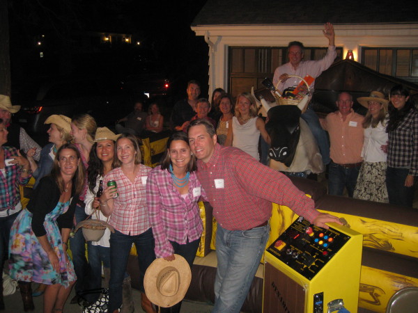 Mechanical bull riding participants gathered at Parmenter’s Hoedown for HEArtplay.  A large group of supporters spent Saturday night, line-dancing, bull-riding and have a great time while supporting Parmenter’s Children’s Bereavement programs. See www.parmenter.org/donate for more information.